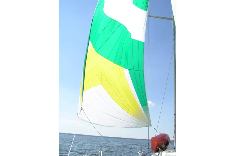 Slide: The Image of Colorful sail on a 1997 Beneteau First 42s7 yacht against a clear blue sky. - 9
