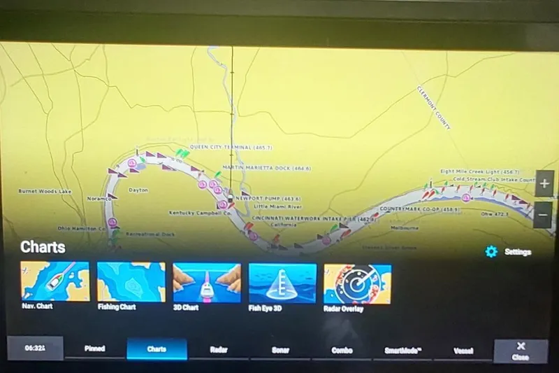 Slide: The Image of Navigation display on Carver 570 Voyager Pilothouse, 2004 model, showing charts and settings. - 13