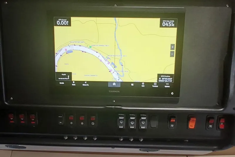 Slide: The Image of Navigation system on a 2004 Carver 570 Voyager Pilothouse boat dashboard. - 15