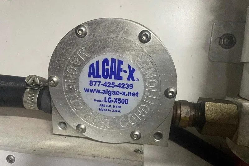 Slide: The Image of Algae-X magnetic fuel conditioner LG-X500 on Carver 570 Voyager Pilothouse, 2004 model. - 30