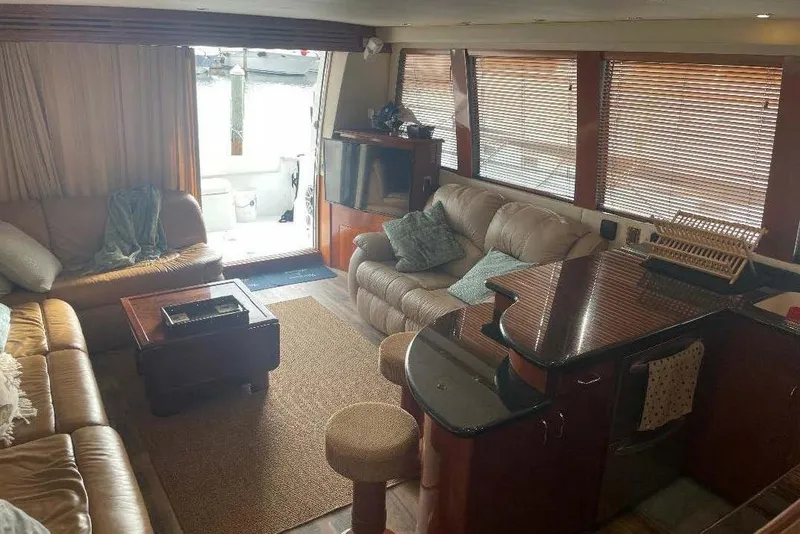 Slide: The Image of Interior of 2004 Carver 570 Voyager Pilothouse with cozy seating and modern amenities. - 17