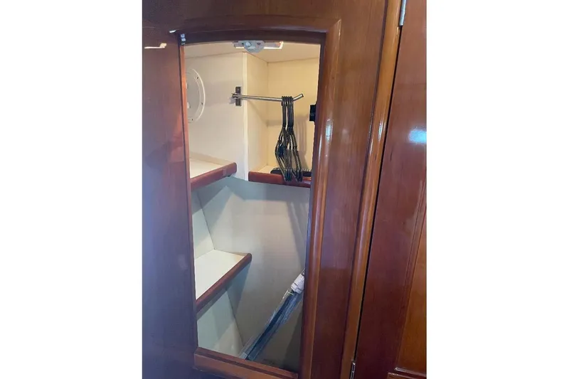 Slide: The Image of Wooden closet interior on 2004 Carver 570 Voyager Pilothouse yacht. - 25