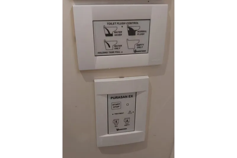 Slide: The Image of Control panels for toilet flush and sanitation system on 2004 Carver 570 Voyager Pilothouse. - 26