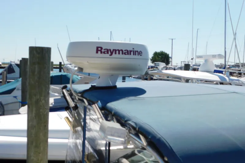 Slide: The Image of 1993 Tiara Yachts 3100 Open with Raymarine radar at marina. - 11