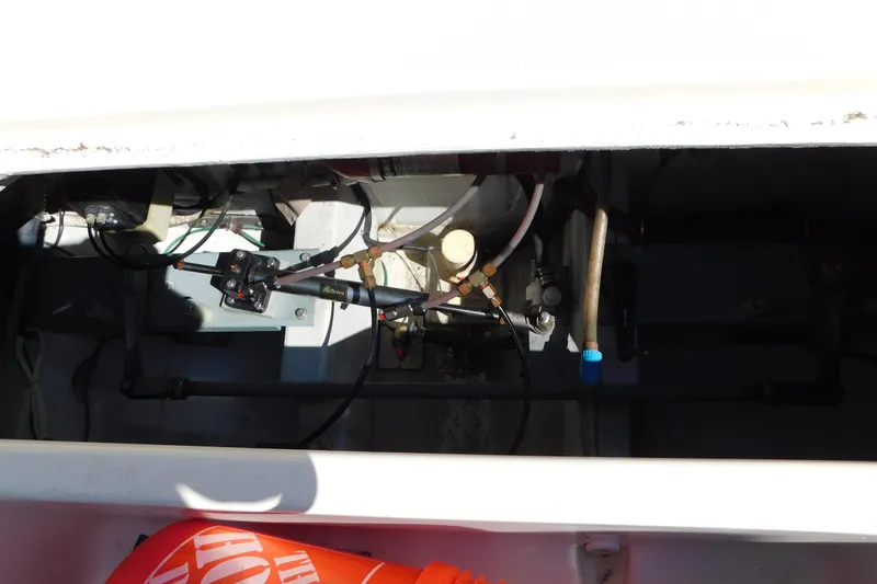 Slide: The Image of Engine compartment of a 1993 Tiara Yachts 3100 Open, showing mechanical components and wiring. - 18