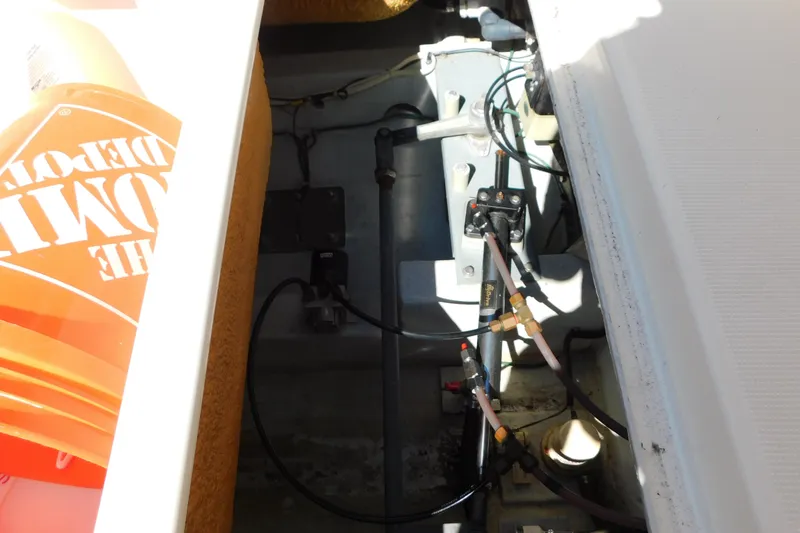 Slide: The Image of Engine compartment of a 1993 Tiara Yachts 3100 Open, showing wiring and components. - 19