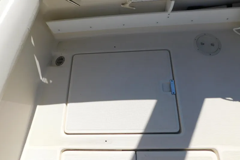 Slide: The Image of 1993 Tiara Yachts 3100 Open deck with storage hatch and drain. - 20