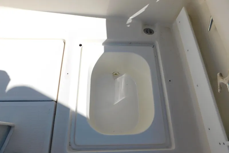 Slide: The Image of 1993 Tiara Yachts 3100 Open deck detail with built-in storage compartment. - 21