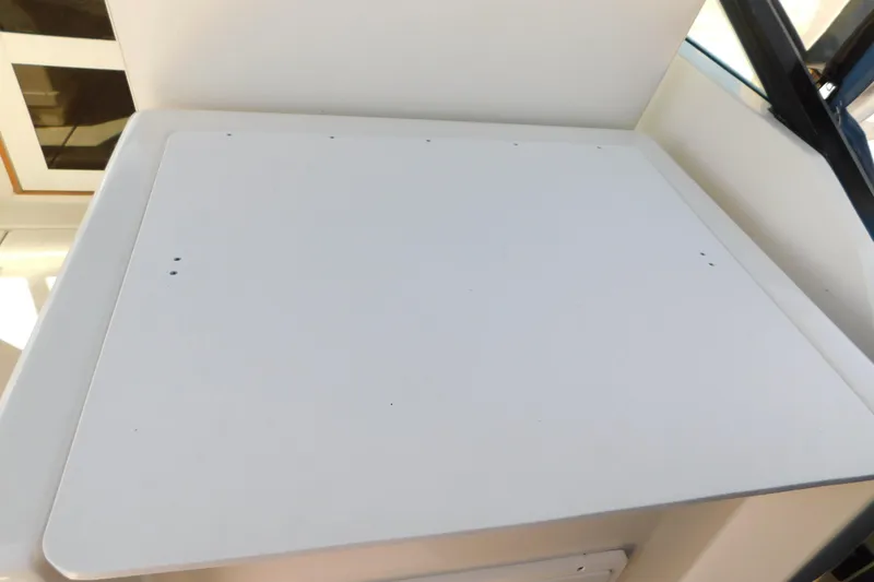 Slide: The Image of Tiara Yachts 3100 Open 1993, white deck surface, minimalistic design. - 29