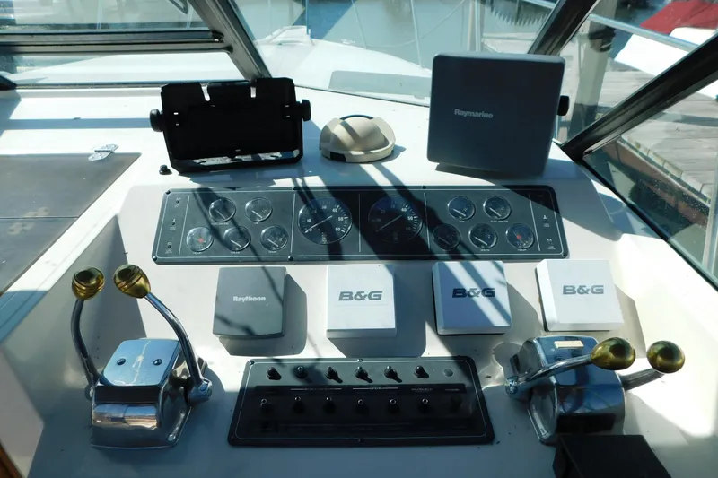 Slide: The Image of Control panel of a 1993 Tiara Yachts 3100 Open with navigation instruments. - 33