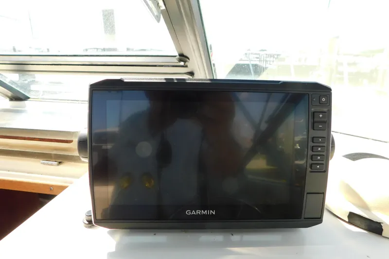 Slide: The Image of Garmin navigation system on 1993 Tiara Yachts 3100 Open dashboard. - 35