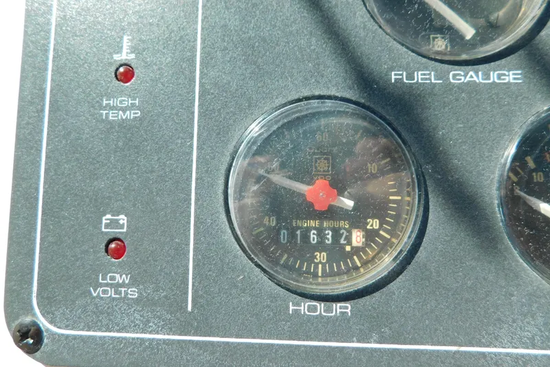 Slide: The Image of Dashboard of 1993 Tiara Yachts 3100 Open showing engine hours and warning indicators. - 36