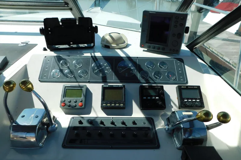 Slide: The Image of Control panel of a 1993 Tiara Yachts 3100 Open, featuring gauges and navigation equipment. - 39