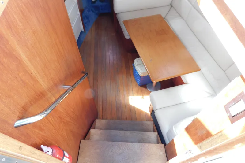 Slide: The Image of Interior of 1993 Tiara Yachts 3100 Open with wooden flooring and seating area. - 51