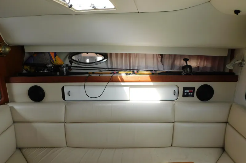 Slide: The Image of Interior of 1993 Tiara Yachts 3100 Open with fishing rods and seating area. - 54