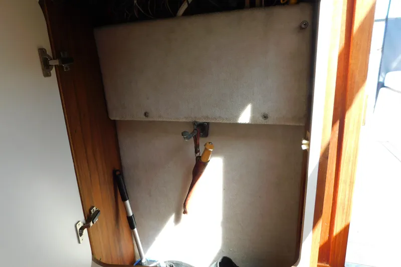 Slide: The Image of Interior storage compartment of a 1993 Tiara Yachts 3100 Open boat. - 59