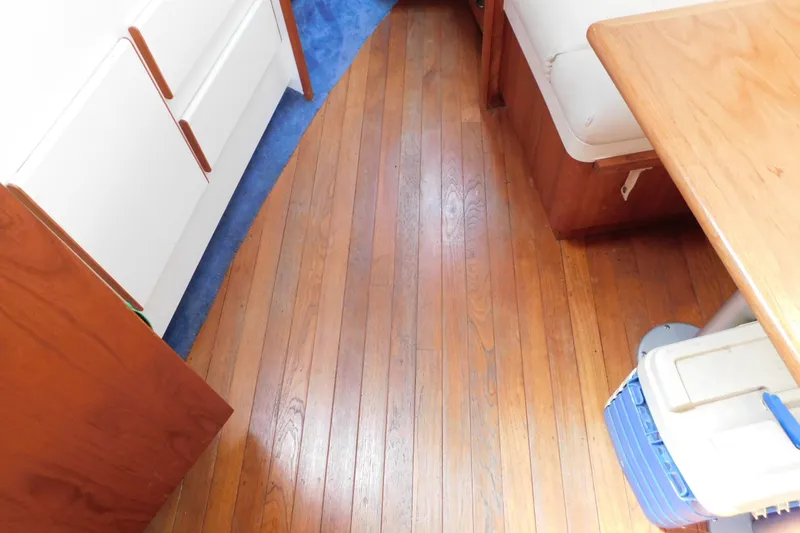 Slide: The Image of Interior of 1993 Tiara Yachts 3100 Open with wooden flooring and seating area. - 63