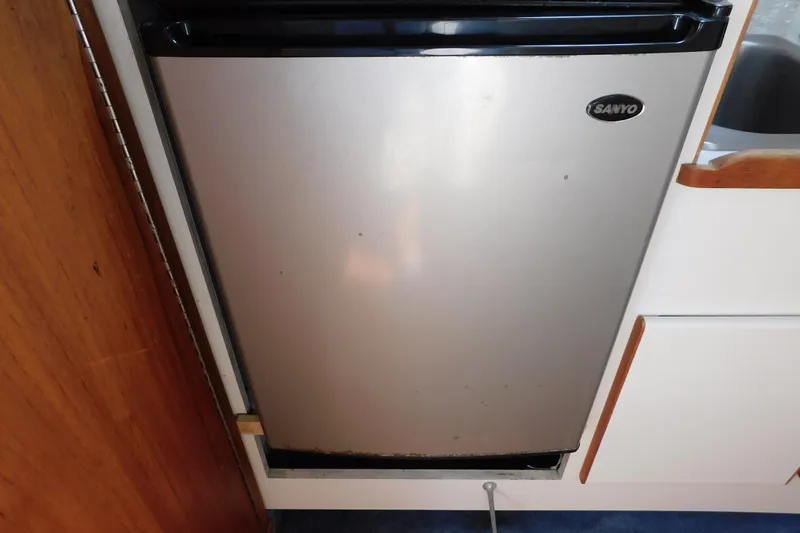 Slide: The Image of Sanyo refrigerator in 1993 Tiara Yachts 3100 Open kitchen area. - 75