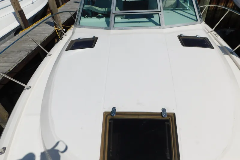 Slide: The Image of 1993 Tiara Yachts 3100 Open boat deck with hatches and railing. - 8