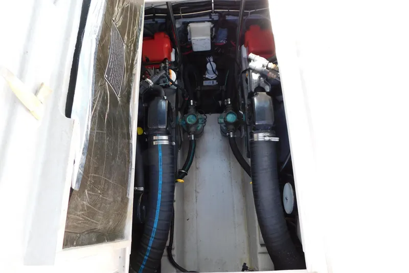 Slide: The Image of Engine compartment of a 1993 Tiara Yachts 3100 Open, showcasing mechanical components. - 86