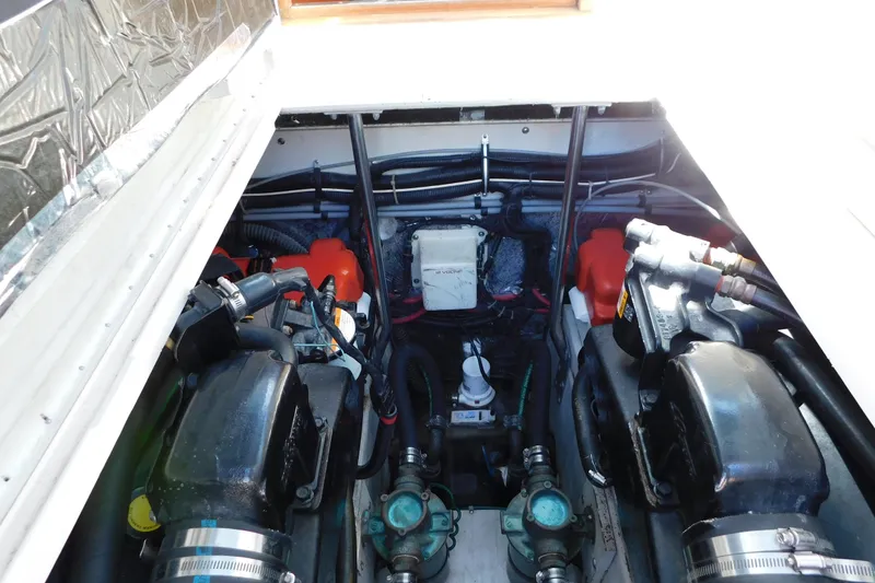 Slide: The Image of Engine compartment of a 1993 Tiara Yachts 3100 Open, showcasing dual engines and components. - 87