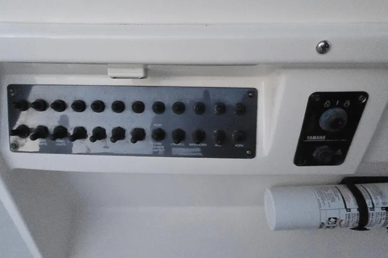 Slide: The Image of Control panel of 2003 Robalo R230 Center Console boat with Yamaha controls. - 11