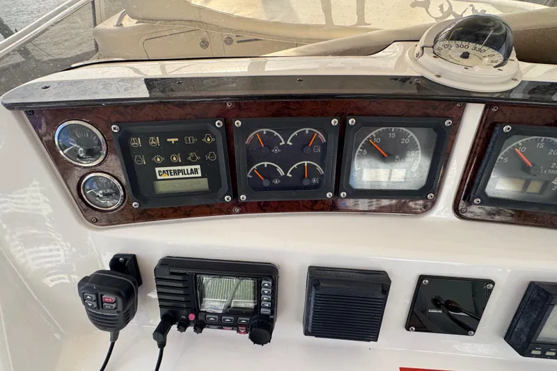 Slide: The Image of 1998 Sea Ray 480 Sedan Bridge dashboard with gauges and navigation equipment. - 17