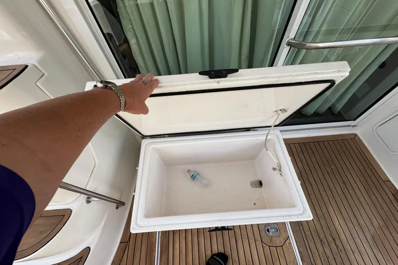 Slide: The Image of Open storage compartment on 1998 Sea Ray 480 Sedan Bridge yacht deck. - 38