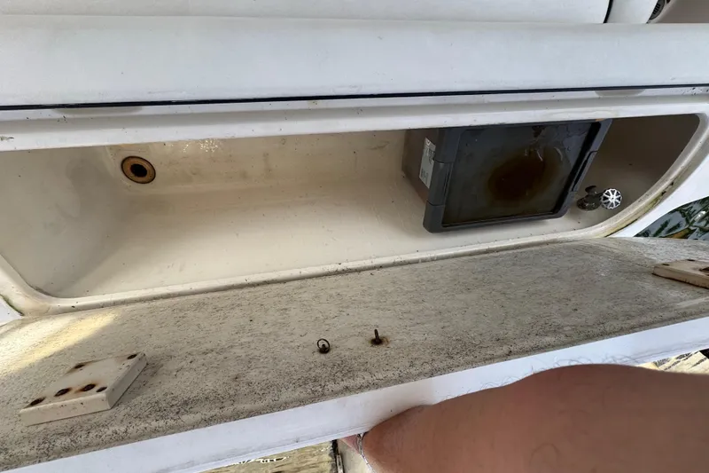 Slide: The Image of Luxurious interior of a 1998 Sea Ray 480 Sedan Bridge with plush seating and elegant decor. - 49