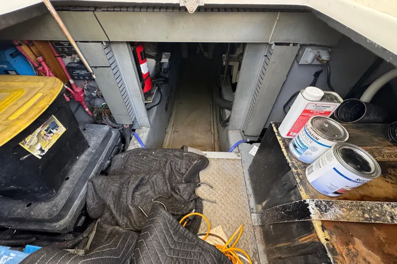 Slide: The Image of 1998 Sea Ray 480 Sedan Bridge yacht deck with wood finish, docked by water. - 51