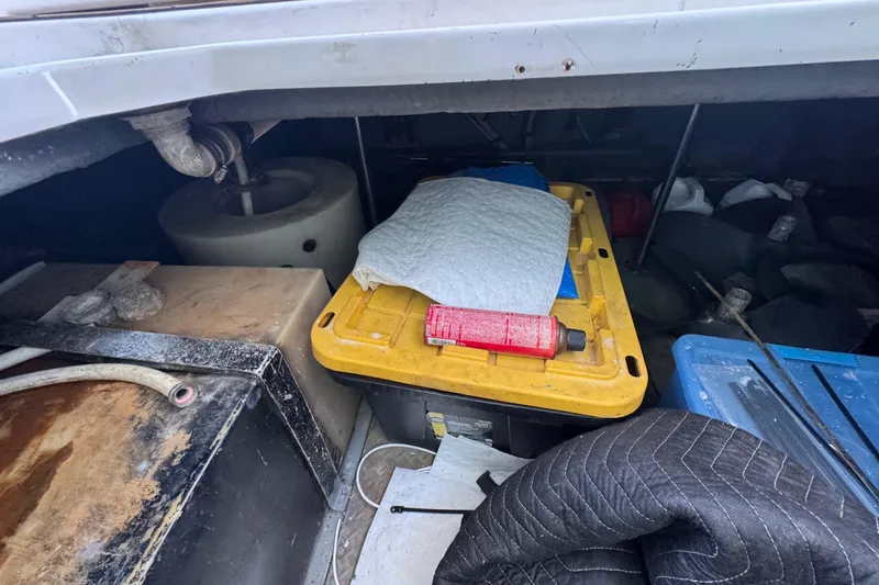 Slide: The Image of Interior of 1998 Sea Ray 480 Sedan Bridge with beige leather seating and wooden accents. - 53