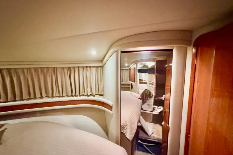 Slide: The Image of Luxurious interior of 1998 Sea Ray 480 Sedan Bridge yacht cabin with elegant decor. - 63