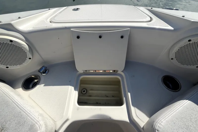 Slide: The Image of 2010 Sea Ray 220 Sundeck boat interior with speakers and storage compartment. - 13