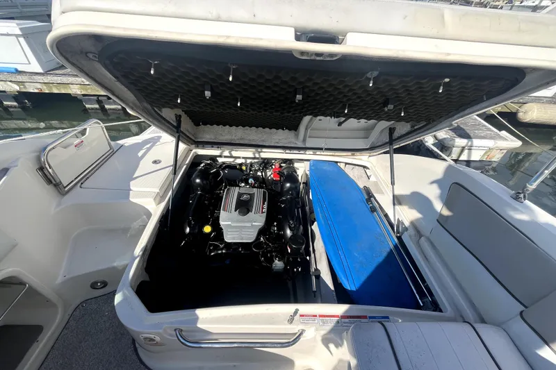 Slide: The Image of Open engine compartment of 2010 Sea Ray 220 Sundeck boat at dock. - 34