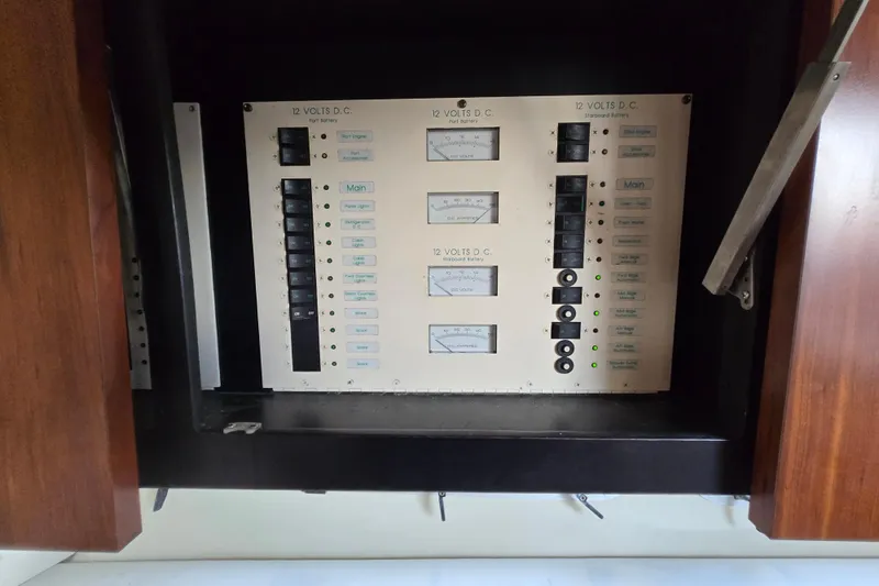 Slide: The Image of Electrical panel of a 1991 Mainship 35 Open Bridge boat, featuring 12-volt DC controls. - 30