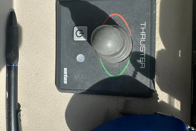 Slide: The Image of Control panel of a 2001 Cruisers Yachts 3870 Express with thruster joystick. - 10