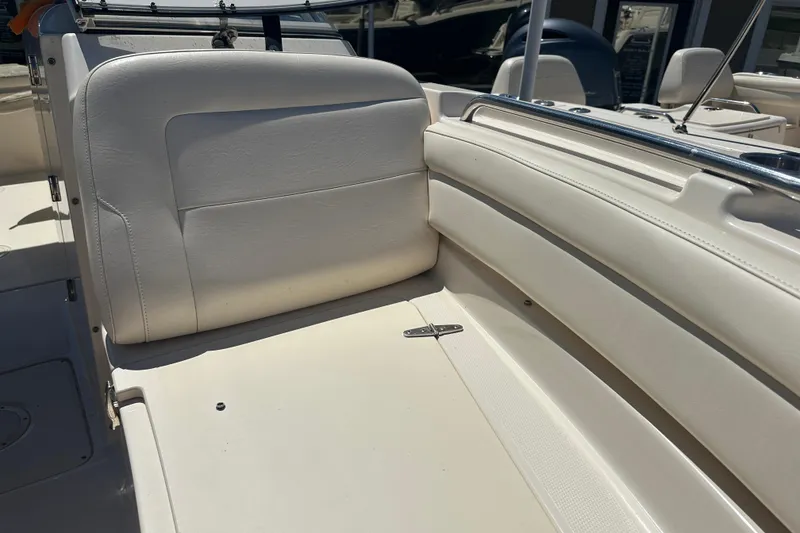 Slide: The Image of 2018 Grady-White Freedom 215 boat interior with white seating and stainless steel accents. - 10