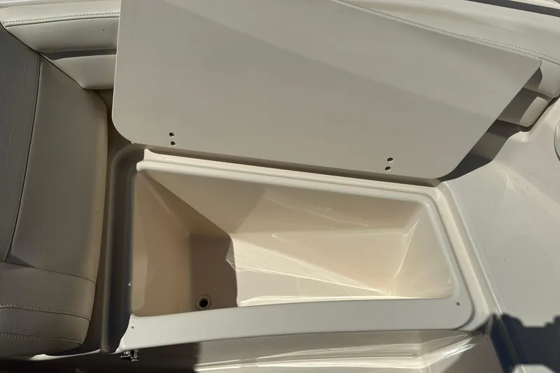 Slide: The Image of Open storage compartment on 2018 Grady-White Freedom 215 boat, showcasing interior space. - 11