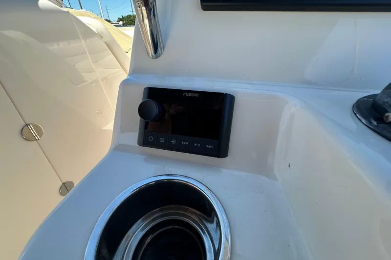Slide: The Image of Fusion audio system on 2018 Grady-White Freedom 215 boat dashboard. - 19