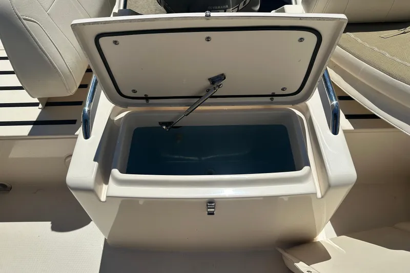 Slide: The Image of Open storage compartment on 2018 Grady-White Freedom 215 boat, showcasing interior space. - 27