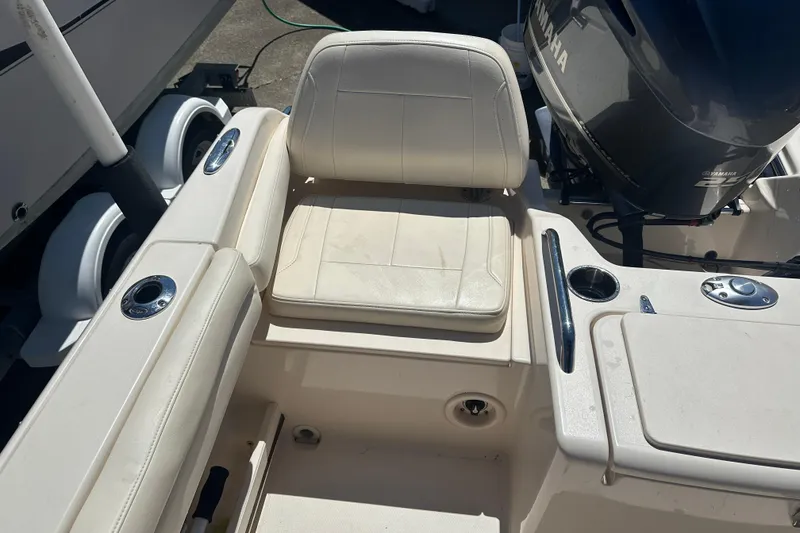 Slide: The Image of 2018 Grady-White Freedom 215 boat interior with seating and Yamaha engine. - 29