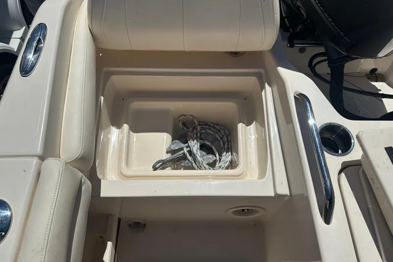 Slide: The Image of 2018 Grady-White Freedom 215 boat interior with storage compartment and rope. - 30