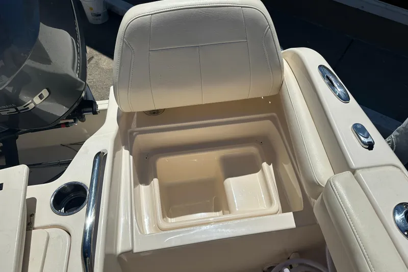 Slide: The Image of 2018 Grady-White Freedom 215 boat seat with storage compartment and cup holder. - 33