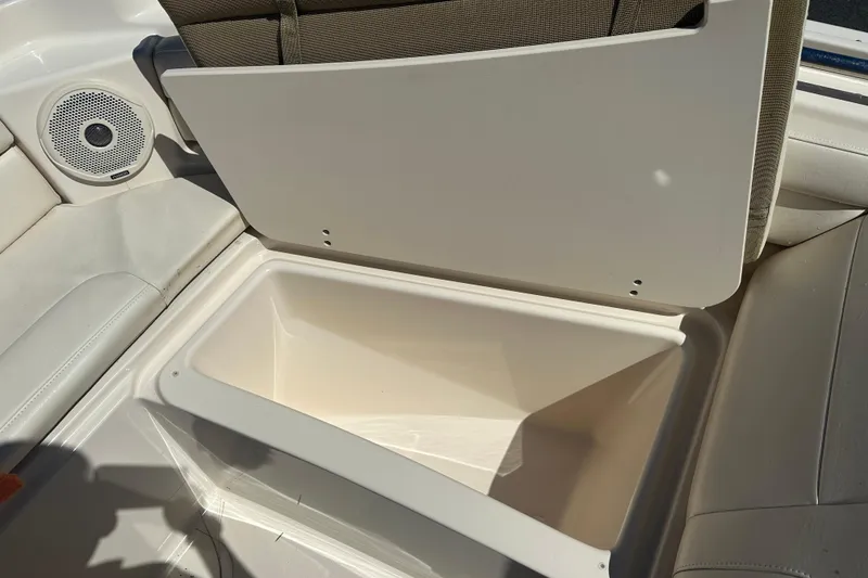 Slide: The Image of 2018 Grady-White Freedom 215 boat storage compartment with speaker and seating. - 8