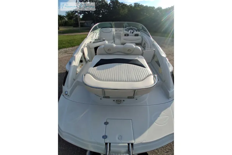 Slide: The Image of 2007 Crownline 320 LS boat with white seating and sleek design. - 10