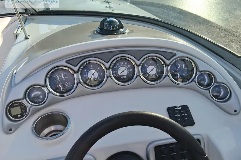 Slide: The Image of Dashboard of 2007 Crownline 320 LS boat with gauges and controls. - 13