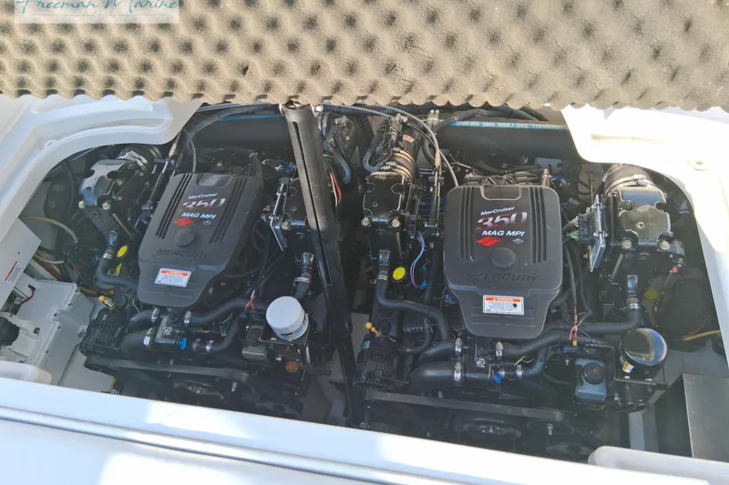Slide: The Image of Twin MerCruiser engines in a 2007 Crownline 320 LS boat. - 14