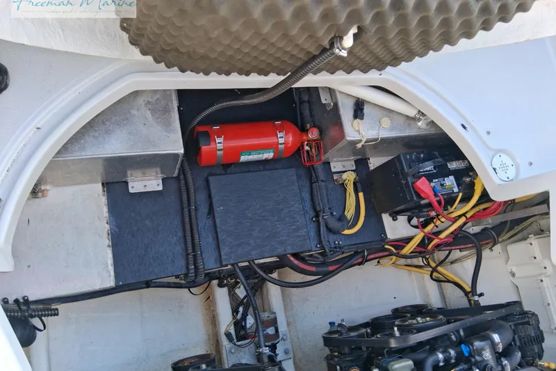 Slide: The Image of Engine compartment of a 2007 Crownline 320 LS boat, showing wiring and components. - 16
