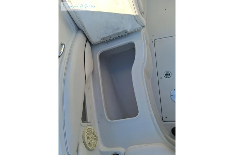 Slide: The Image of 2007 Crownline 320 LS boat interior storage compartment and seating area. - 27