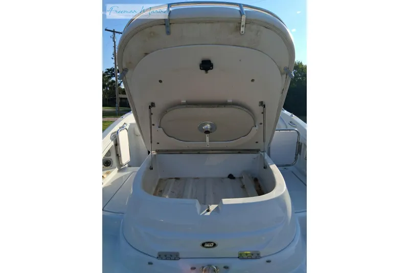 Slide: The Image of Open storage compartment on a 2007 Crownline 320 LS boat, showcasing interior space. - 30